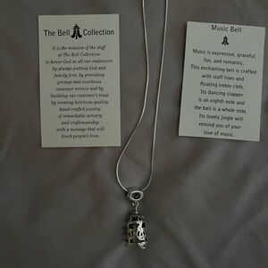Music themed Sterling silver necklace and bell.